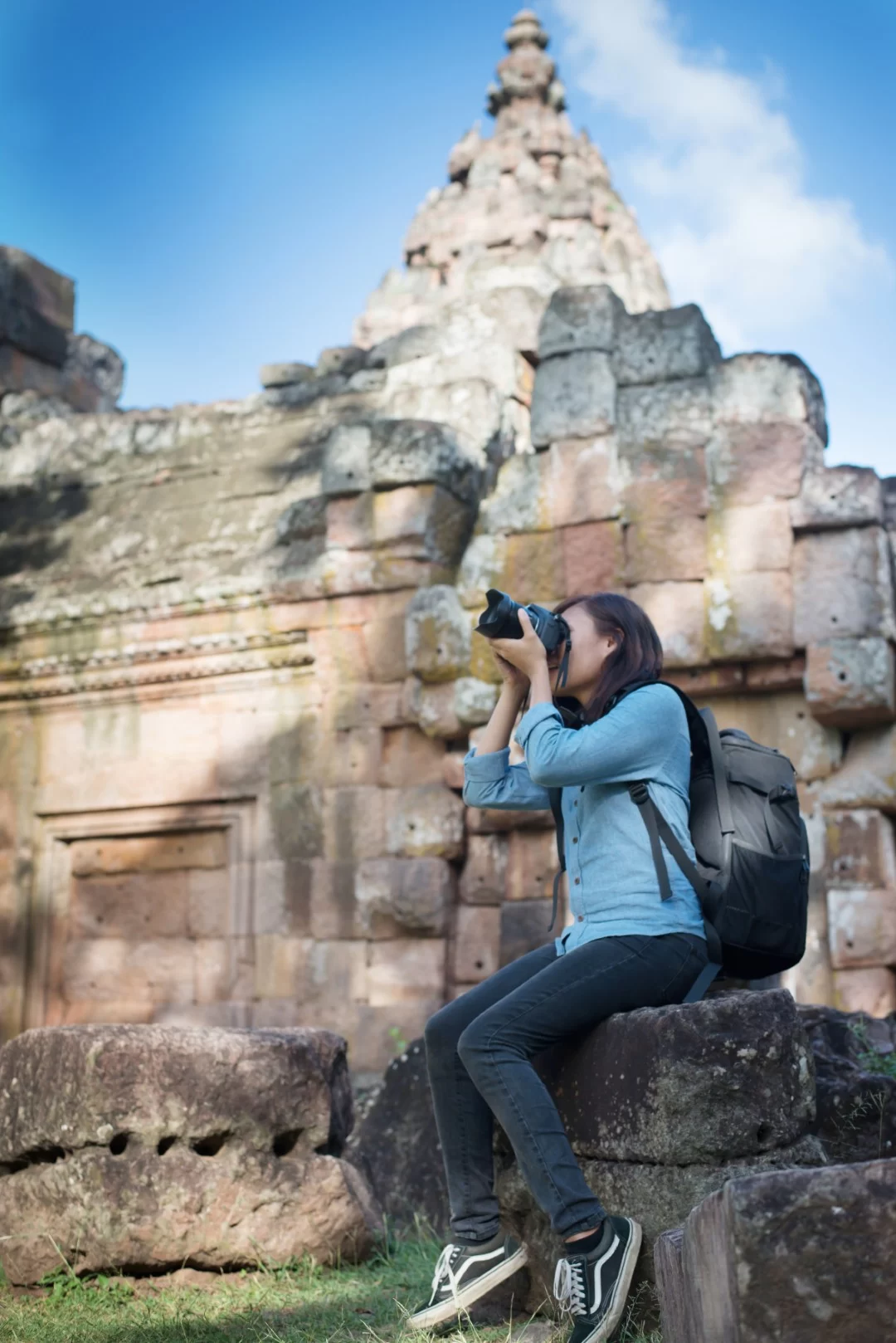 Young attractive woman photographer tourist with backpack coming Teotihuacan Tour from Mexico City Pyramids, Basilica & Tequila
